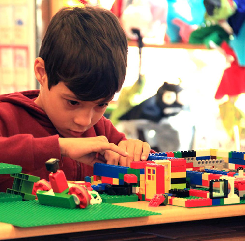 Elementary aged boy working with blocks