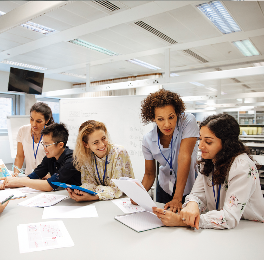 A group of adults working together at a conference table