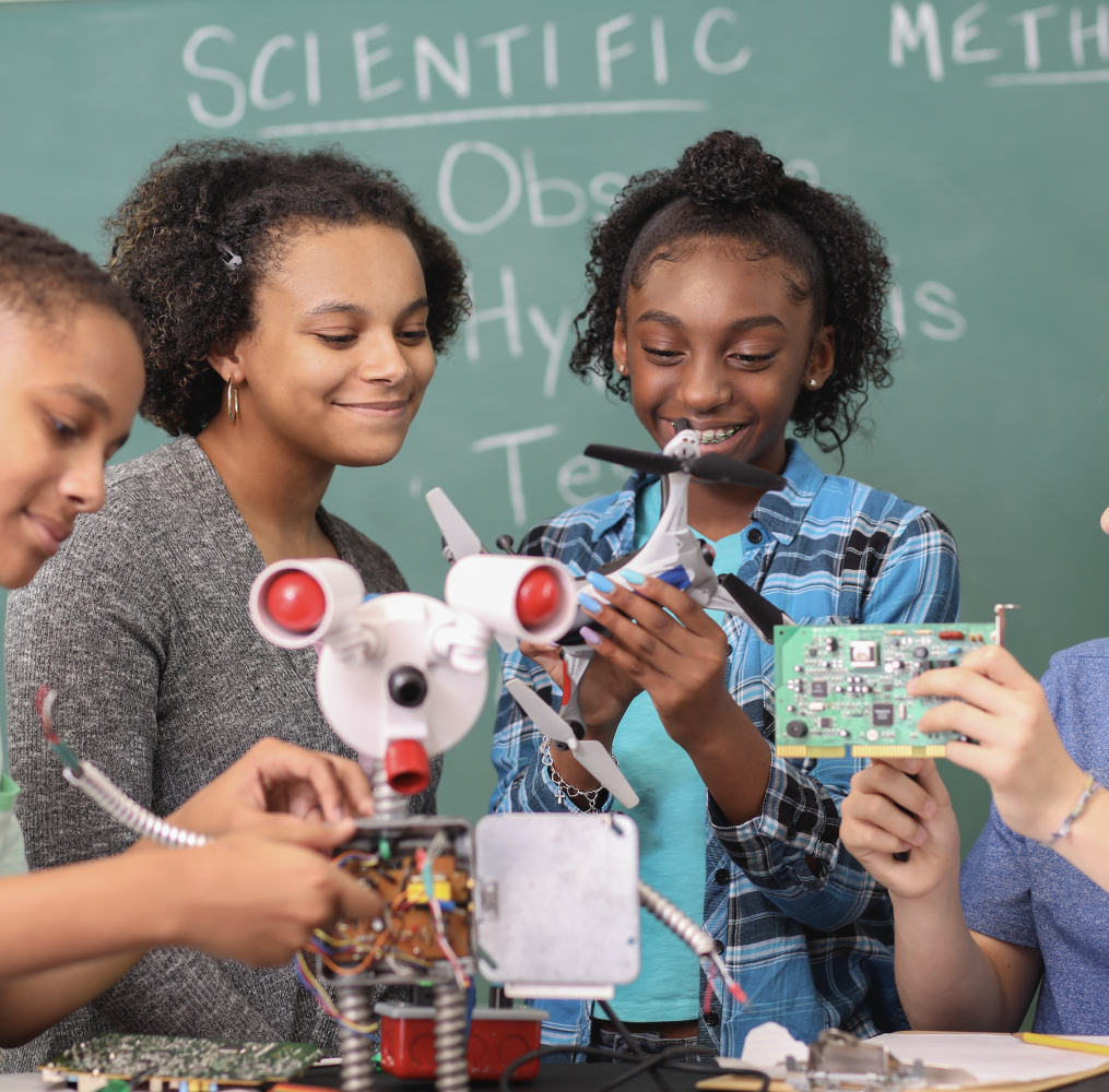 Group of students working on a robotics assignment.