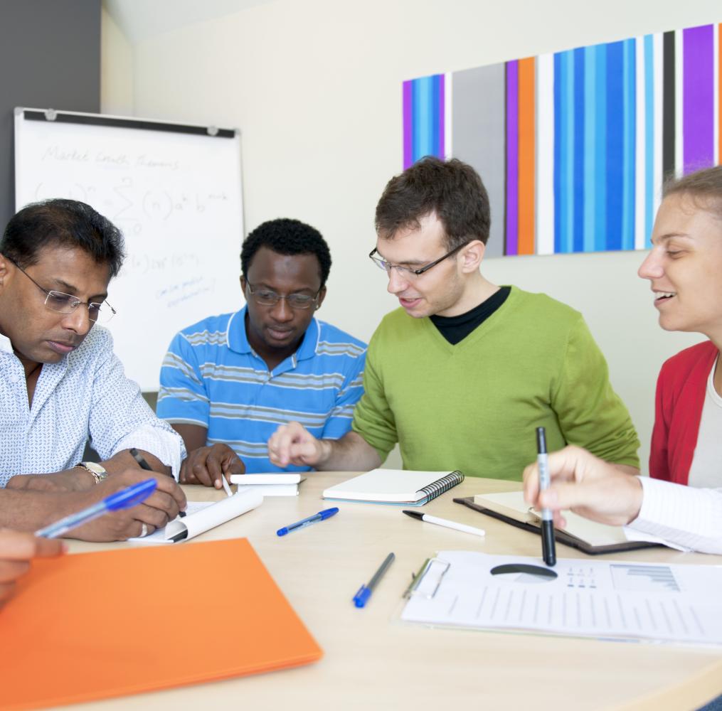 Group of educators seated around a table.