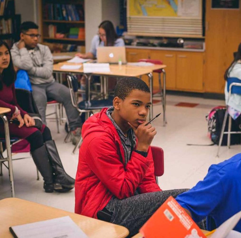 A student focusing on a lecture.