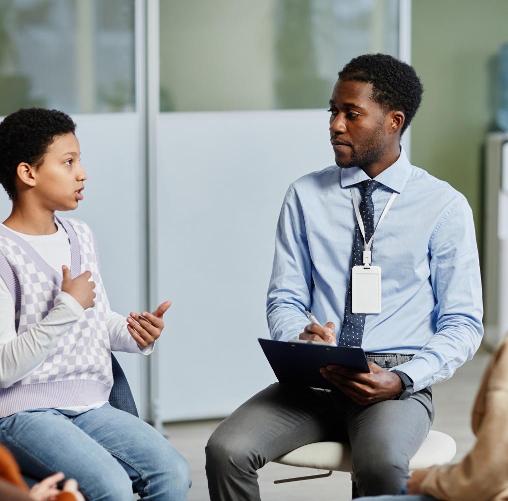 Students having a discussions with a teacher.