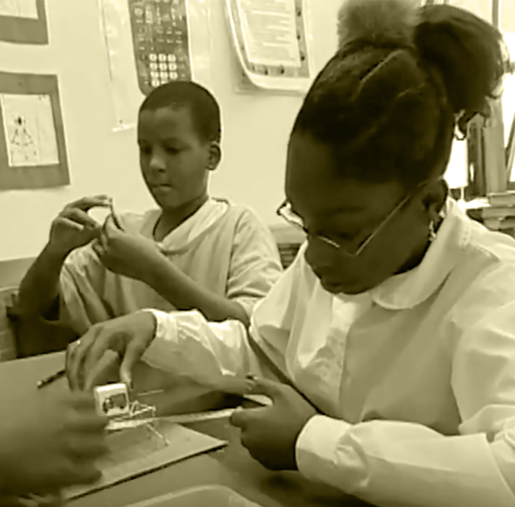 Two students working on a science project.