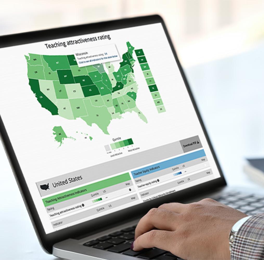 A closeup of a laptop with the State of the Teacher Workforce map on the screen.