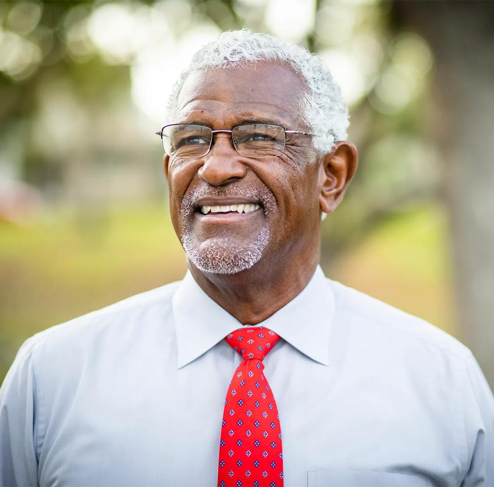 A smiling older man.