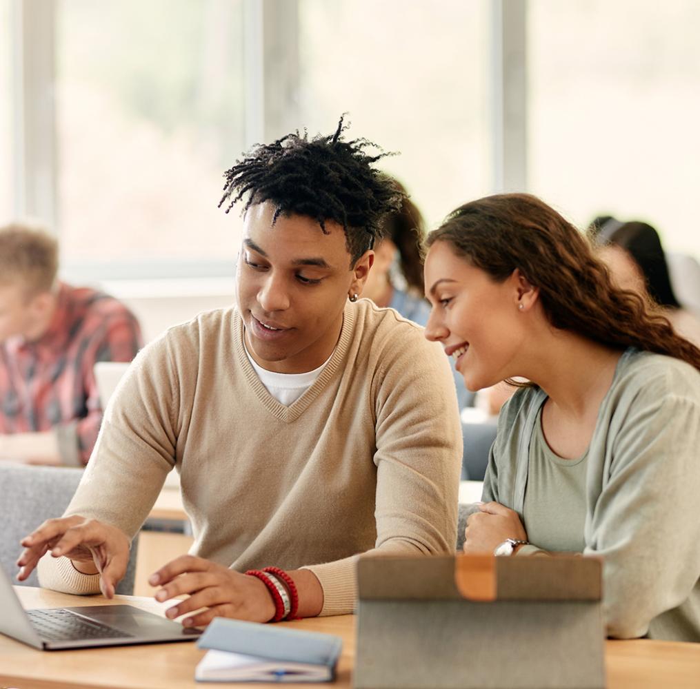 Two college students working collaboratively.