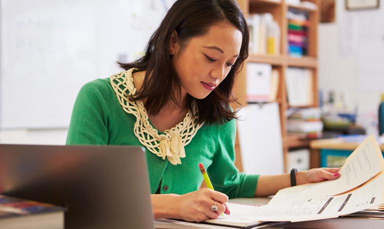 Asian woman working at a desk