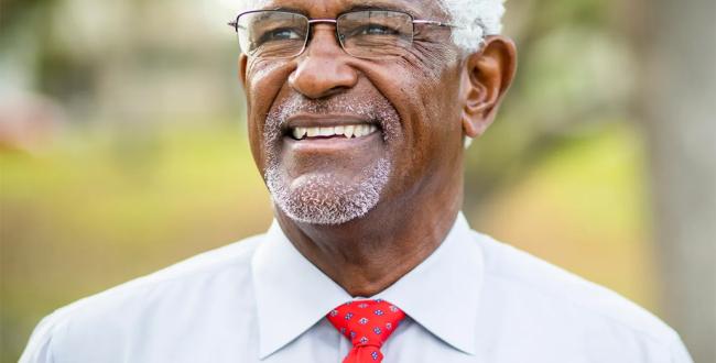 A smiling older man.