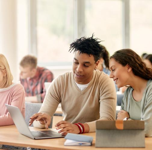 Two college students working collaboratively.