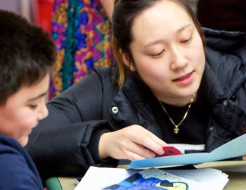 teacher with an elementary aged student