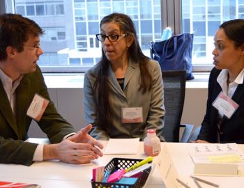 A group of adults having a discussion at a conference table