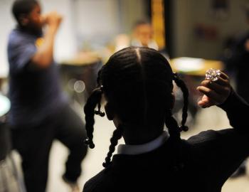 Fifth and sixth grade students warm up for class at a private K-12 school in Washington, D.C., October 2012