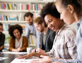 Group of people working in an academic setting.