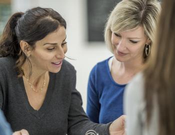 Two women having a discussion.