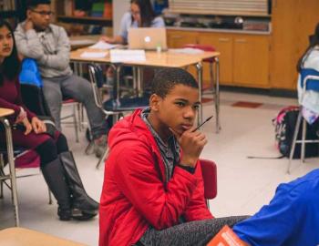 A student focusing on the lecture.