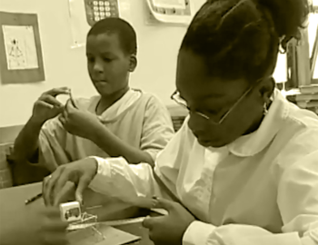 Two students working on a science project.