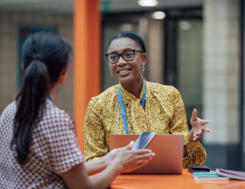 Two educators having a discussion.