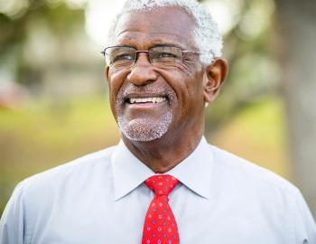 A smiling older man.