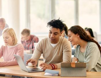 Two college students working collaboratively.