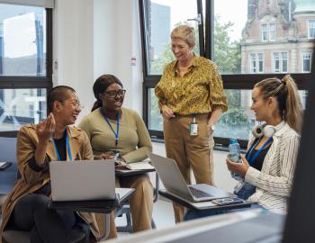 Group of adults in a classroom.